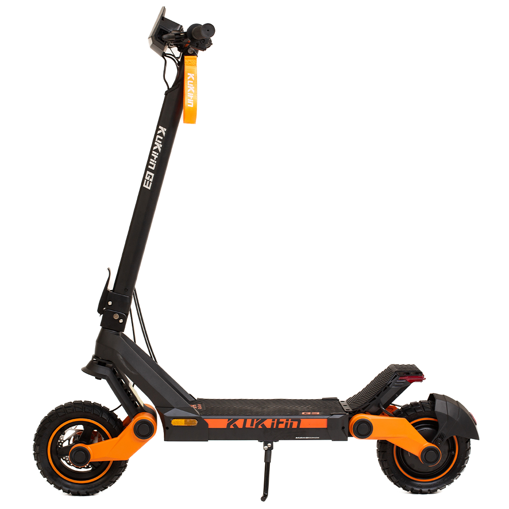 An electric scooter with black and orange color scheme, featuring a large battery and pneumatic wheels, standing upright.